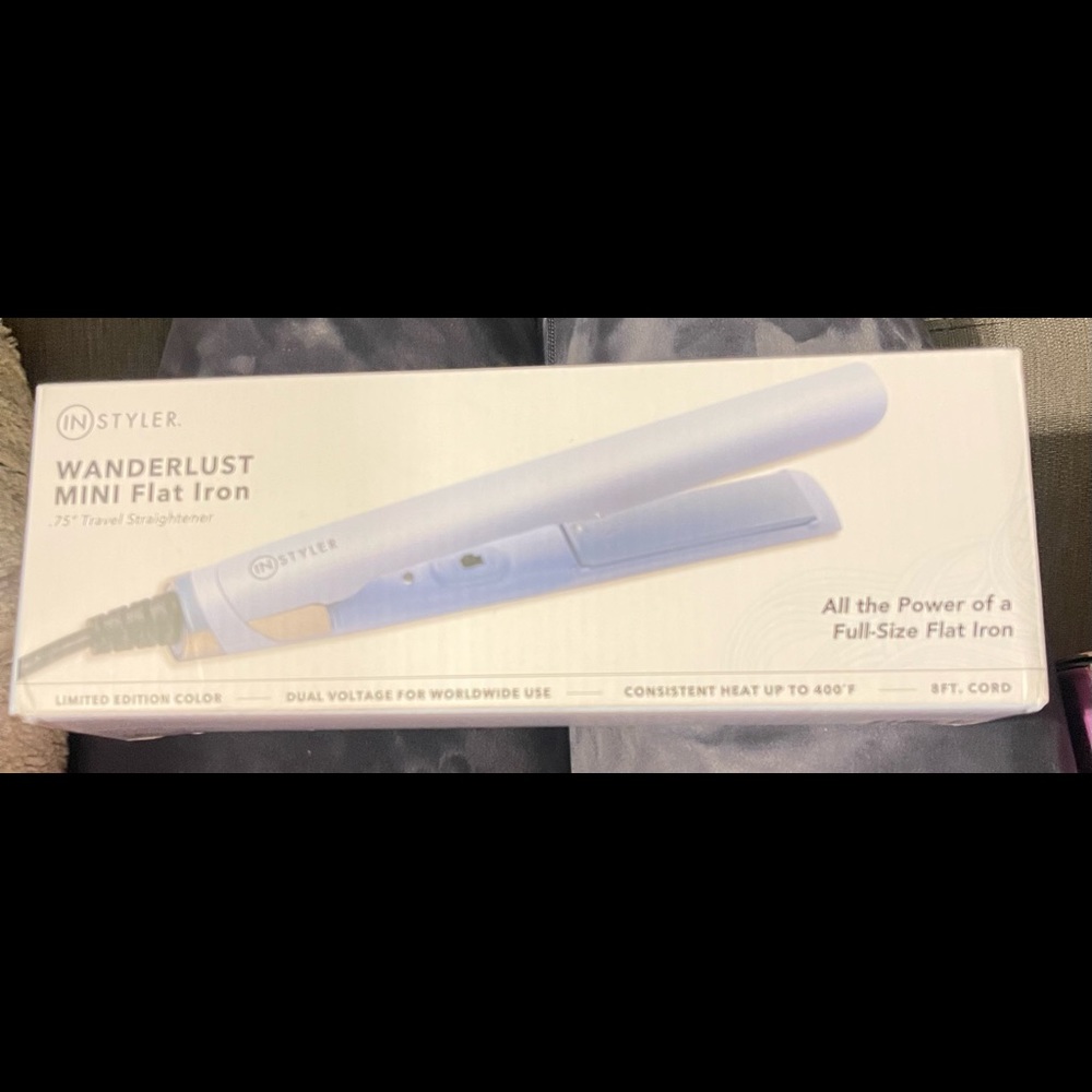 In styler brand new mini flat iron. Never opened!